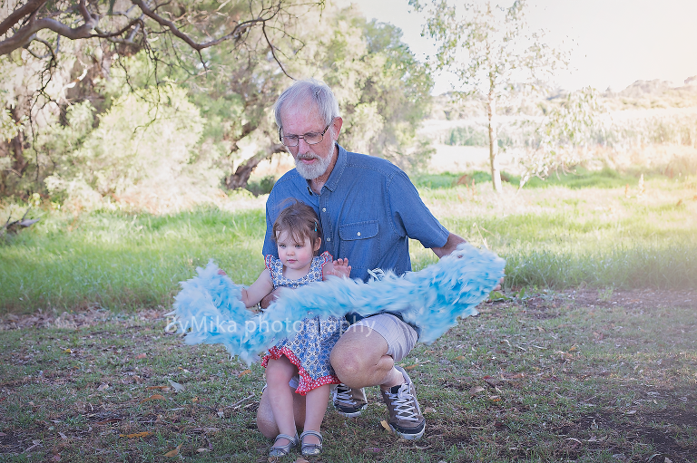Grand dad and his grand daughter playing together during a photo session at Carine outdoor