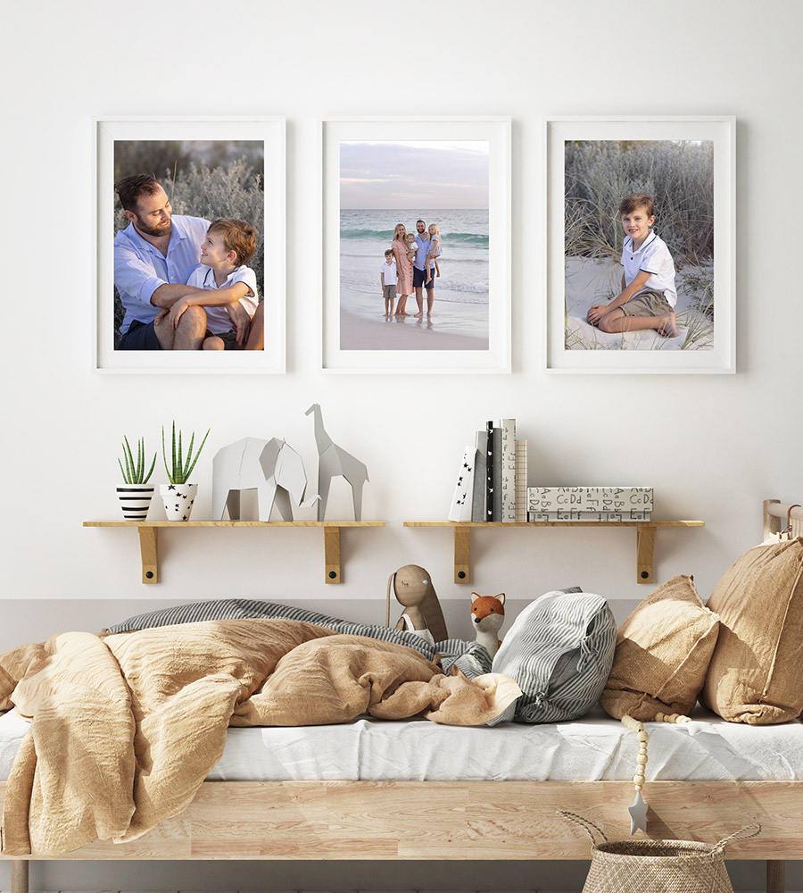 Boys bedroom with family photos on the wall